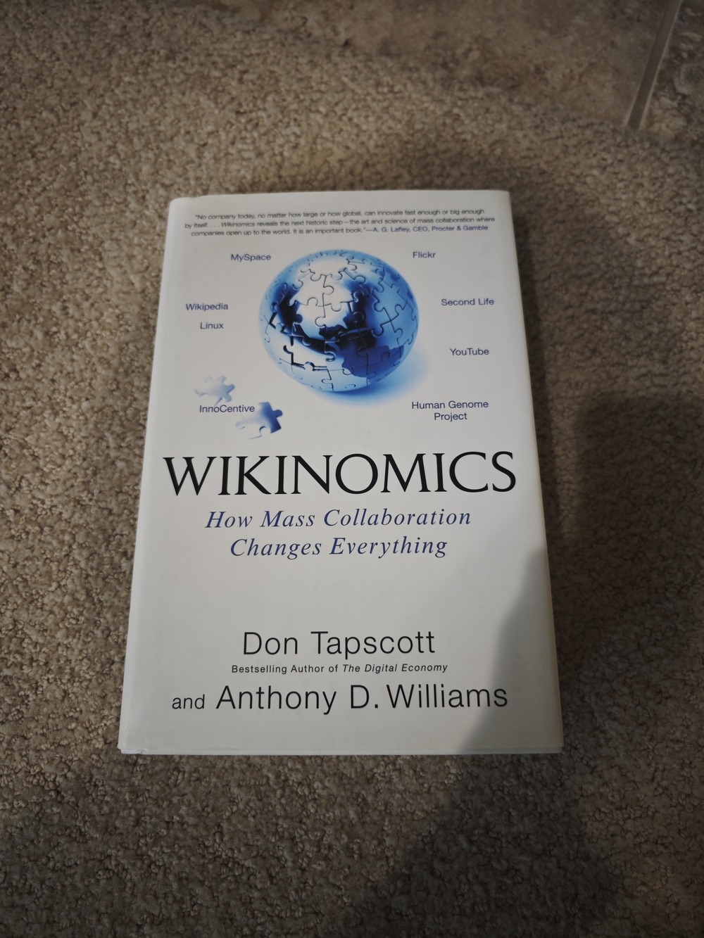 Wikinomics by Don Tapscott - White Cover with Blue Globe